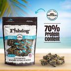 Fishdog cod skin bites packaging with protein content text on a beach background